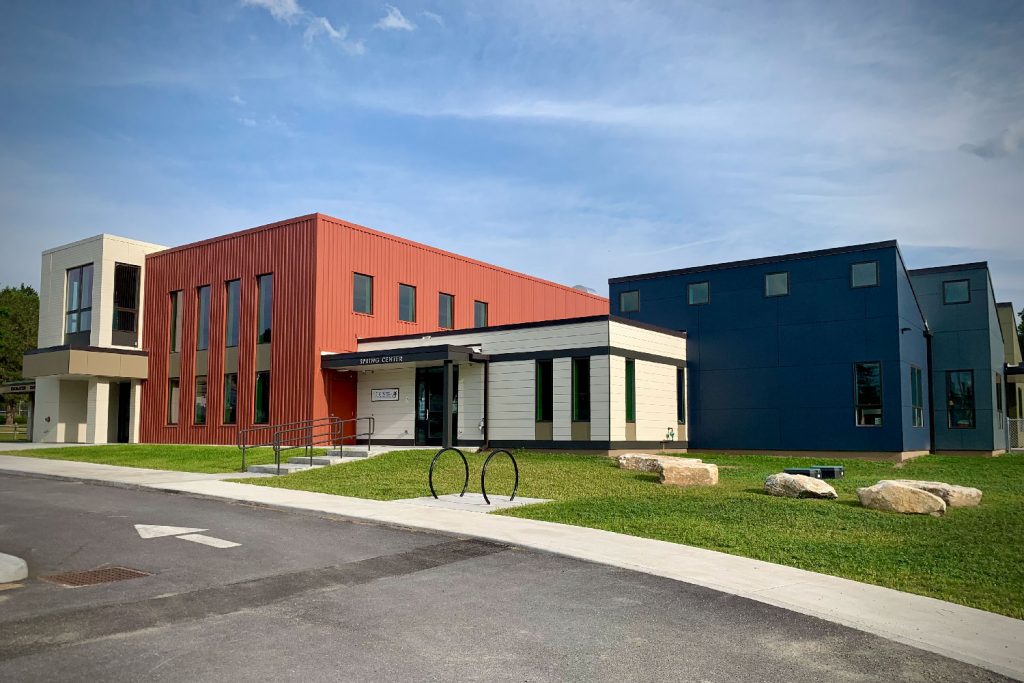 The Bennington Community Center with the Spring Center. The sky. is blue and the grass is green. A beautiful summer day.