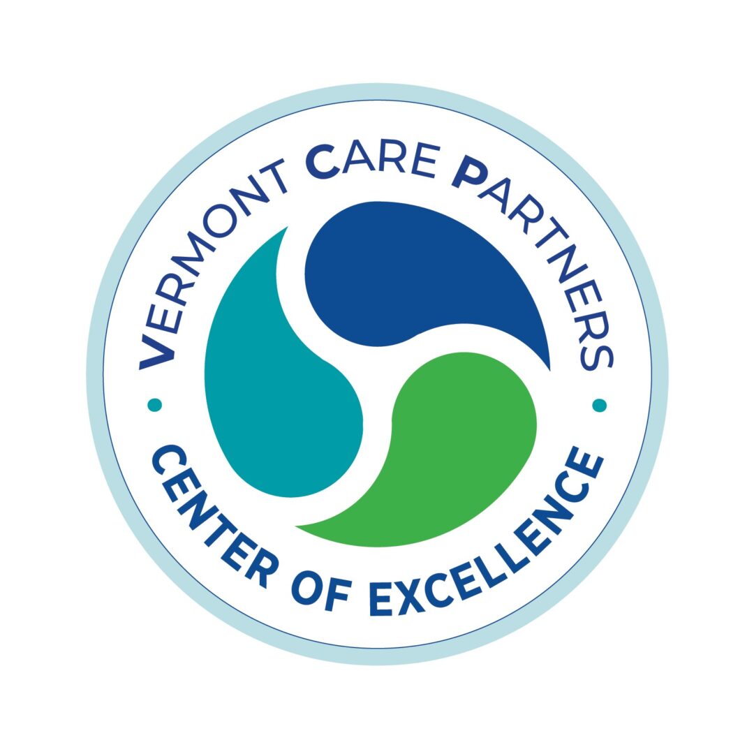 Blue circle with Vermont Care Partners Center of Excellence