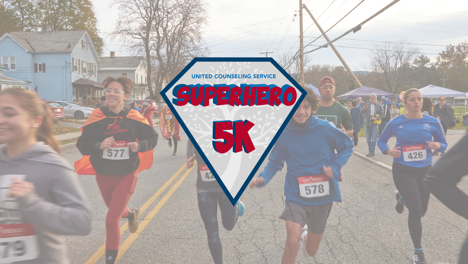 Group of children running on road with the Superhero 5K Logo overlaid