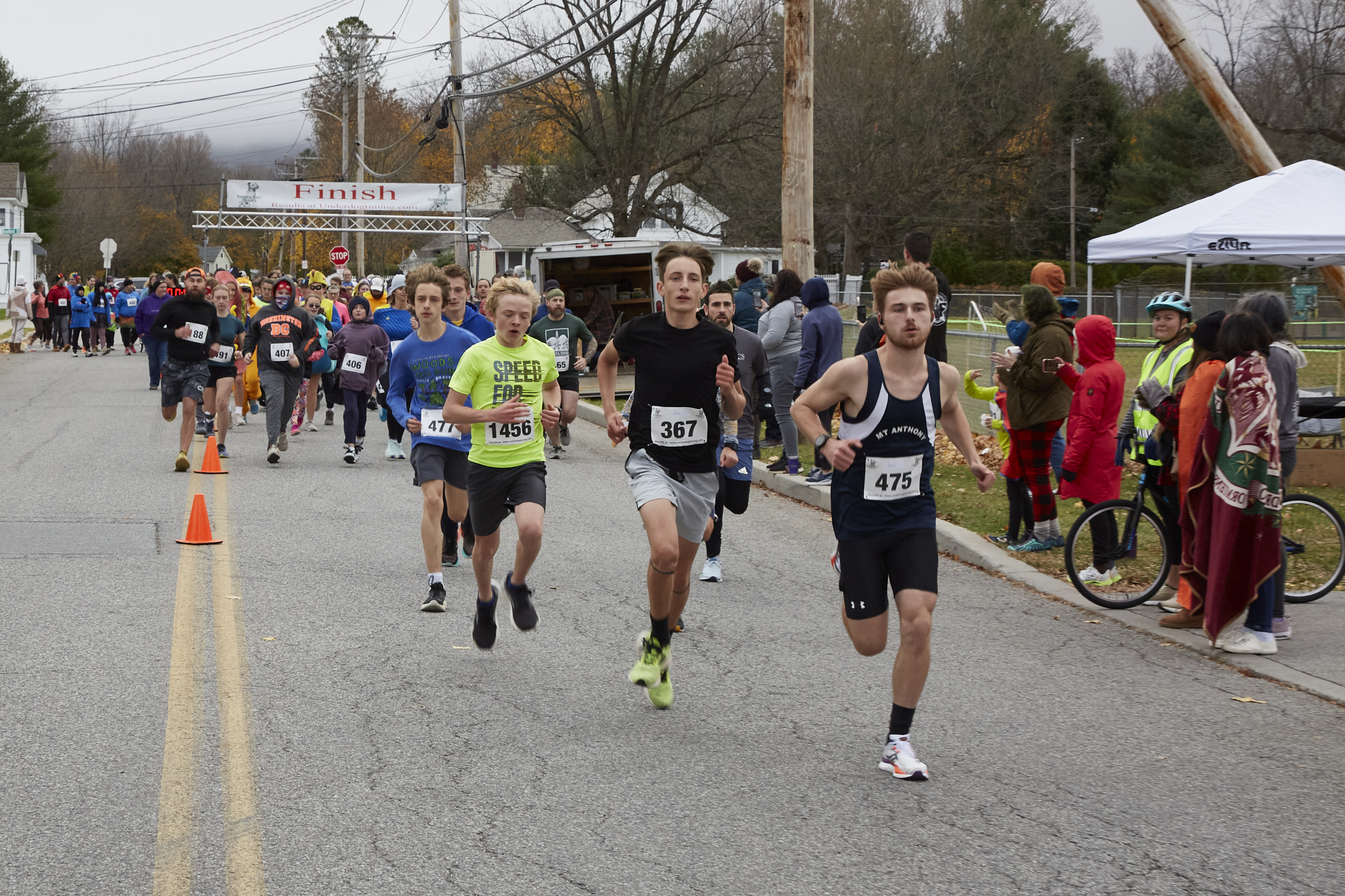Young boys running on road