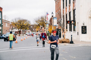 kids run in a race in a downtown setting