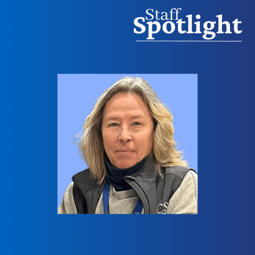 woman with blonde hair wearing a gray vest with a light blue background within a darker blue background and Staff Spotlight in white on the top right